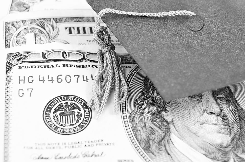 money with a graduation cap